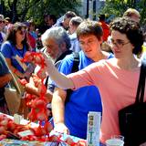 A crowd gathering around garlic stand at Pocono Garlic Festival