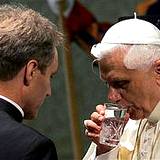 Pope Benedict drinking a glass of water