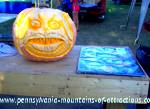 photo of a huge pumpkin carved into a beautiful work of art