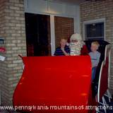 Children visiting Santa in his sleigh at Lakemont Park's Holiday Lights on the Lake.